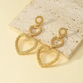 Golden textured heart-shaped triple-layered drop earrings with woven metal patterns - Gold