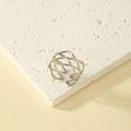 Macro detail of the silver geometric crisscross mesh ring on a white marble stone surface - One Size (Adjustable Open) / White Gold