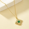 Vintage 18K gold necklace with green cat-eye stone pendant in geometric sunburst design - Gold