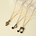 Set di tre collane con note musicali dorate e ciondoli in smalto nero raffinato - Set Oro