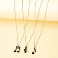 Set di tre collane con note musicali con chiave di violino in smalto nero e simboli - Set Gioielli d'Argento