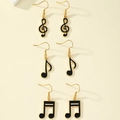 Set di tre paia di orecchini smaltati color oro con chiave di violino e note musicali - Set Oro Nero (3 Paia)