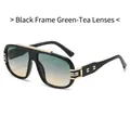 Lunettes de soleil carrées noires avec verres dégradés vert thé et détails dorés - Monture Noire Verres Thé Vert