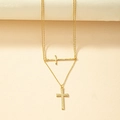 Minimalist double-layered gold necklace featuring a sleek cross pendant and fine chain - Gold