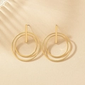 Minimalist geometric gold earrings with double circular hoops and long vertical metal bars - Gold