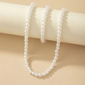 Elegant white pearl necklace set with creamy luster draped on a minimalist display - Pearl Necklace & Bracelet Set