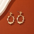 Golden oval wreath drop earrings with white pearls and sparkling crystals on a warm base - Gold
