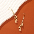 Elegant gold-tone long fringe drop earrings with matte and polished beads - Gold