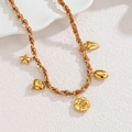 Luxurious stainless steel sweater necklace with rose and heart charms on woven leather chain - Rose Style / Gold/Brown