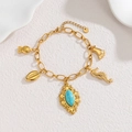 Detailed view of 18k gold link bracelet with turquoise and ocean themed charms - Sea Creatures Turquoise Style (D Style)
