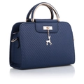Dark blue embossed tote bag with gold deer pendant and round handles on white background - Dark Blue