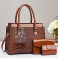 Detailed view of the three-piece lizard pattern tote bag set in dark caramel brown finish - Earthy Yellow