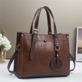 Brown contrast leather patchwork tote bag with white stitching and double handles - Brown