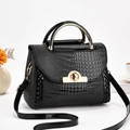 Black lizard pattern faux leather handbag with gold metal handle and turn-lock closure - Black
