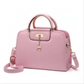 Pink embossed faux leather handbag with metal handles and a golden deer pendant charm - Pink