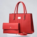Red woven leather tote bag and pouch set with gold hardware on a display stand - Wine Red