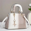 Detail view of gradient white crocodile texture handbag with gold hardware and charm - White and Brown