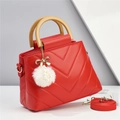 Red quilted leather handbag with wooden handle and plush pom-pom pendant charm - Red