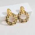 Retro plaid weave hollow round hoop earrings with gold texture and enamel finish - Black and White