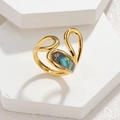 Macro detail of irregular gold ring with iridescent shell inlay on white stone - Streamlined Hollow Colorful Abalone Style (CXR916-D-cai)