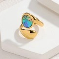 Macro shot of irregular geometric gold ring with iridescent shell inlay on white stone - Round Bypass Colorful Inlay Style (CXR916-F-cai)