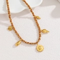Detail of vintage braided leather necklace with gold sunflower and shell pendants - Sunflower & Pinecone Style / Gold/Brown