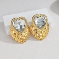 Luxe 18k gold plated heart earrings with large clear crystals and hammer texture finish - White
