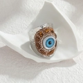 Gehamerde zilveren roestvrijstalen evil eye ring met blauwe en witte stenen - Zilver
