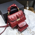 Burgundy textured handbag set with pleated handle and gold geometric lock on marble surface - Wine Red
