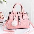 Pink crocodile pattern tote bag with metal buckle and plush charm detail - Green