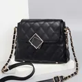 Classic black quilted shoulder bag with golden geometric lock and chain strap for women - Small / Black