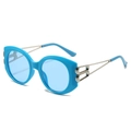 Lunettes de soleil ovales bleues à la mode avec détails BB en métal argenté pour femmes - Monture Bleue / Verres Bleus