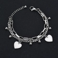 Detail of silver stainless steel double-layer chain with white heart charms and ball pendants - Double Heart Style / Silver