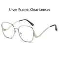 Silver frame sunglasses with clear lenses and rhinestone-encrusted curved temples - Silver Frame Clear Lenses