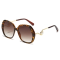 Lunettes de soleil oversize écaille avec branches dorées et détail de perle blanche - Monture Léopard Verres Dégradés Thé