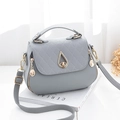 Grey pebbled leather crossbody bag with quilted flap and drop-shaped gold metal lock - Gray