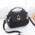 Chic black lychee grain bag with white quilted flap and gold teardrop twist lock - Black
