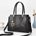 Structured black crocodile pattern tote bag with metal heart pendant on white background - Black