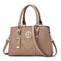 Deep beige women's handbag with V-shaped stitching and gold metallic charms - Khaki