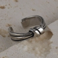 Vintage knot open ring in antique silver finish on minimalist stone background - Knot with Parallel Lines Style (R569)
