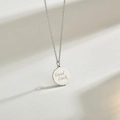 Collier minimaliste avec pendentif pièce ronde Good Luck et bordure ondulée - Couleur Acier
