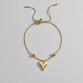 Elegant gold heart pendant bracelet with adjustable slider chain in a minimalist style - Gold Heart Bracelet