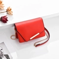 Red PU leather crossbody bag with asymmetric flap and golden ROMANTIC PARIS text - Red