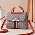 Gray quilted crossbody bag with red trim and golden metal circular handles for women - Red