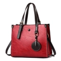 Deep red pleated leather tote bag with brown handles and white contrast stitching - Red