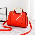 Bright red PU handbag featuring gold cat-ear metal handles and adjustable strap - Red