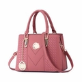 Pink PU leather handbag with V-shaped quilting and gold hardware on white background - Pink