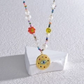 Collana boho con perline colorate, ciondoli smiley e medaglia occhio greco - Colorato