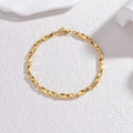 Bracciale a maglie ritorte Mobius minimalista in acciaio al titanio dorato lucido con chiusura - Oro