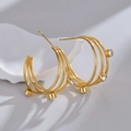 Detail of 18K gold-plated triple hoop earrings featuring sparkling round cubic zirconia - Zirconia Inlaid Three-Line Earrings